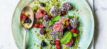 Frozen summer fruits with mint sugar