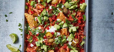 Spicy chicken nachos with avocado & lime cream