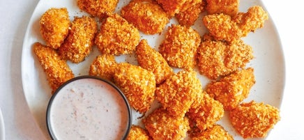 Nacho-coated turkey nuggets with creamy salsa dip
