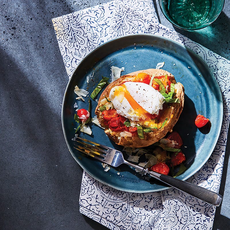 Baked potato with tomato and fried egg