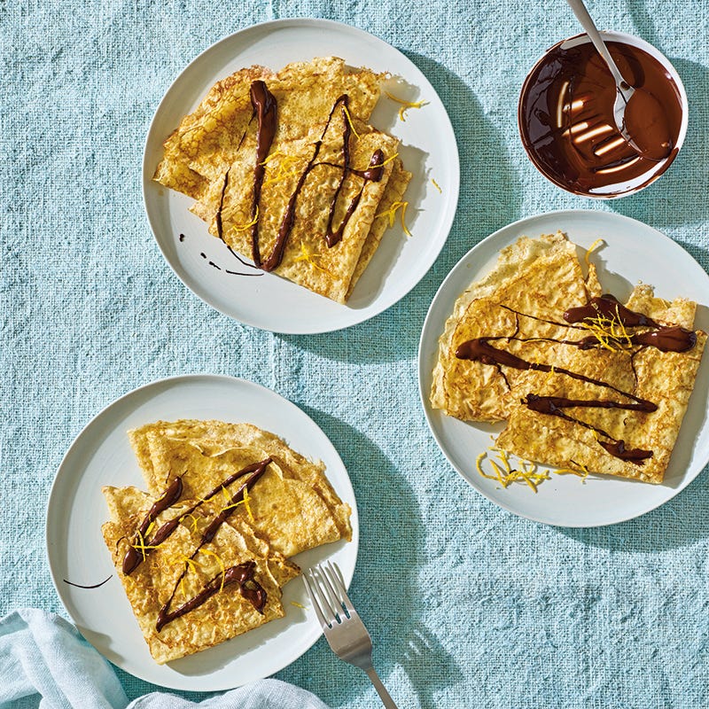Orange crepes with chocolate drizzle