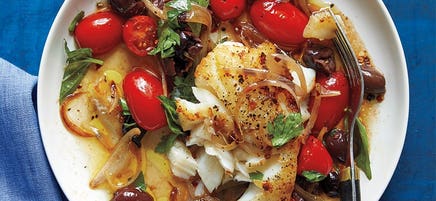 Sautéed fish with tomato and olives