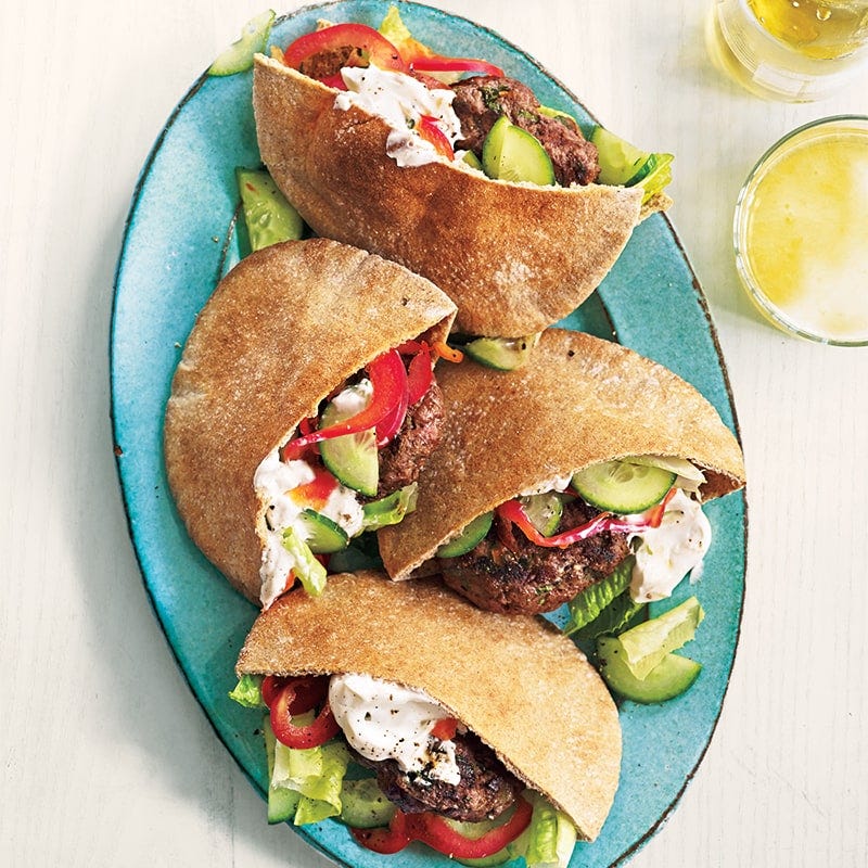 Grilled lamb patties in pitas
