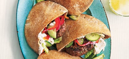 Grilled lamb patties in pitas