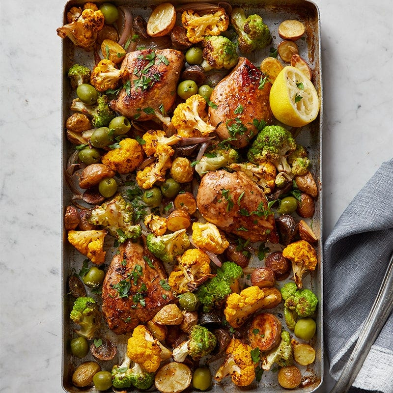 Garlic chicken with cauliflower, potatoes and olives tray bake
