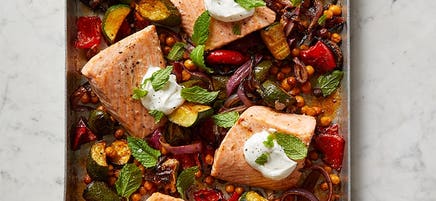 Roasted salmon with chickpeas, zucchini, and capsicum tray bake