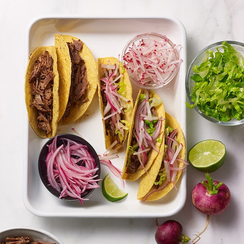 Slow-cooked spicy Mexican pulled pork tacos