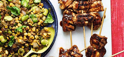 Beer-glazed chicken skewers with succotash