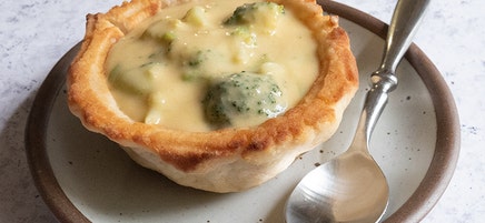 Broccoli-cheese soup in bread bowls