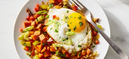 Sweet potato breakfast hash with fried eggs by Millie Peartree