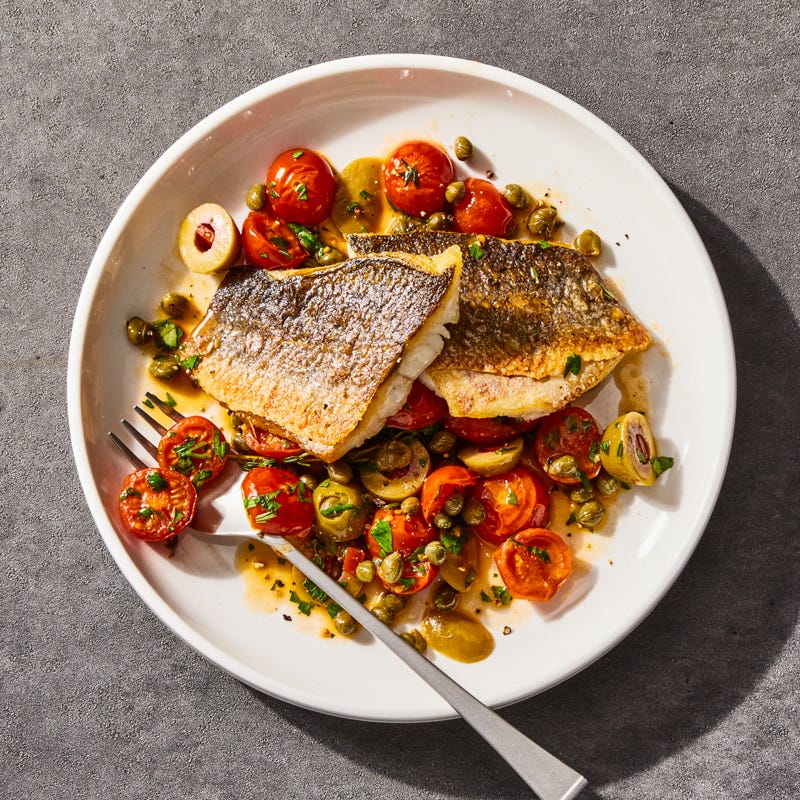 Photo of Pan-seared branzino with tomatoes, olives, and capers by Millie Peartree by WW