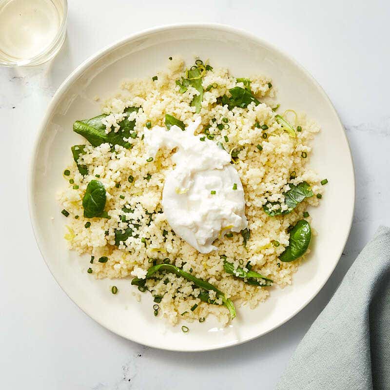 Lemony-spinach couscous with creamy burrata by Millie Peartree
