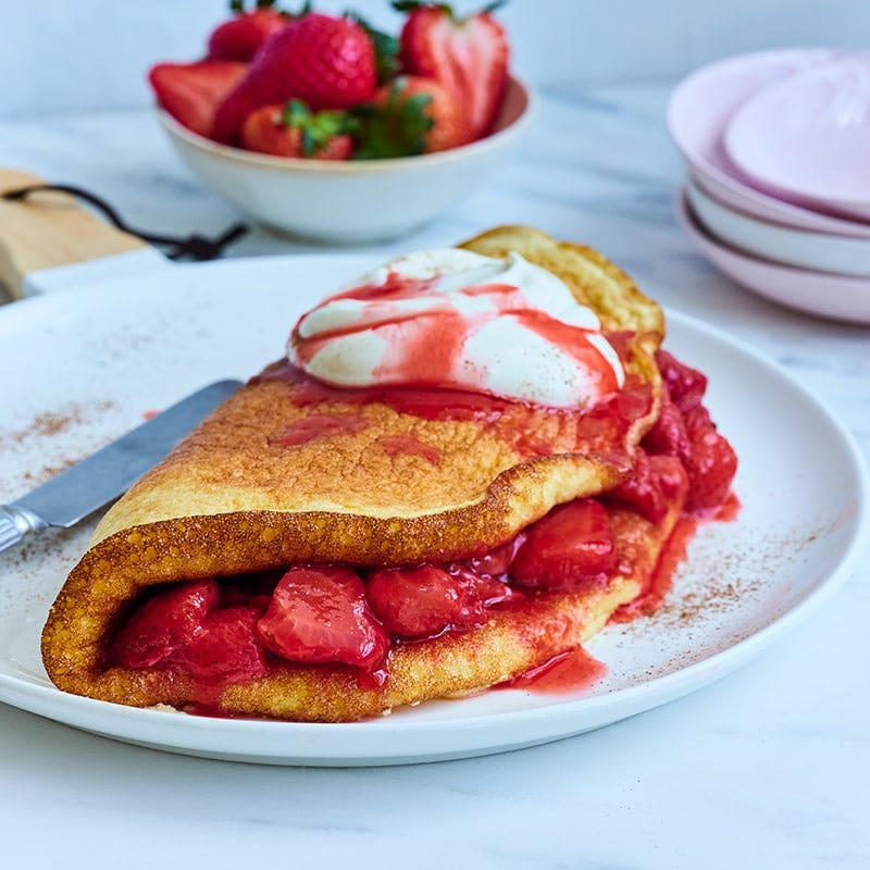 Vanilla souffle omelette with glazed strawberries