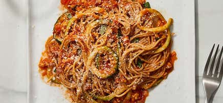 Spicy spaghetti and zucchini noodles with turkey bolognese by Millie Peartree