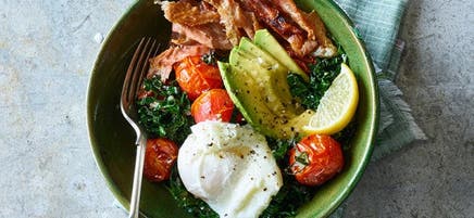 Egg and prosciutto breakfast bowls with tender greens