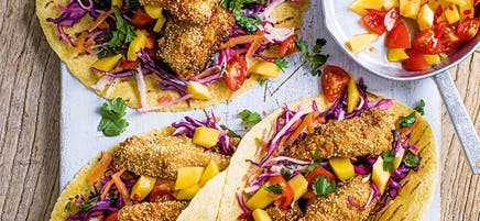 Crispy fish tacos with lime slaw and mango salsa