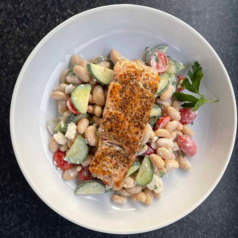 Photo of Salmon Over Mediterranean Bean Salad with Feta and Yogurt Sauce by Coach Emily by WW