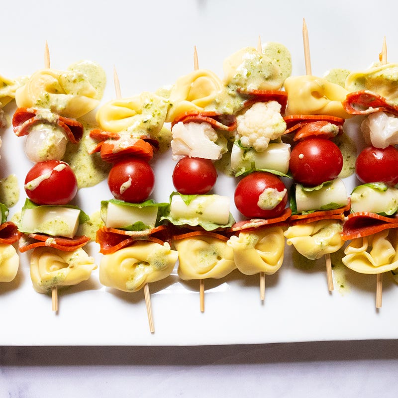Antipasto pasta skewers with creamy pesto drizzle
