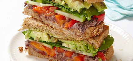 Veggie sandwich with lemony black bean spread