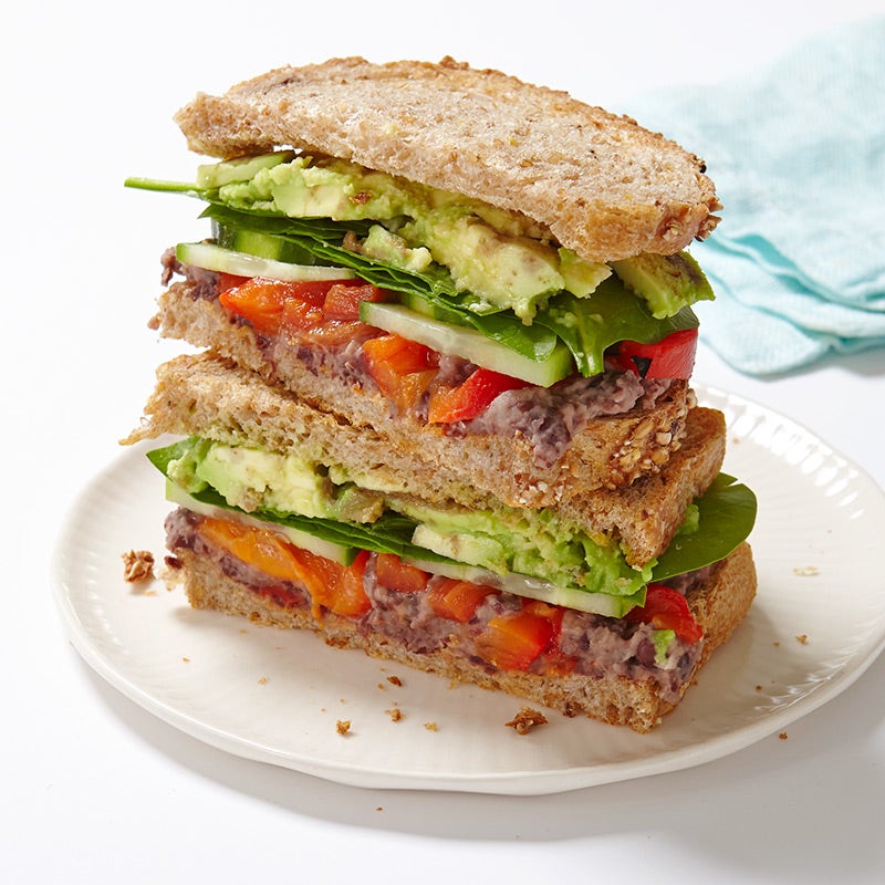 Veggie sandwich with lemony black bean spread