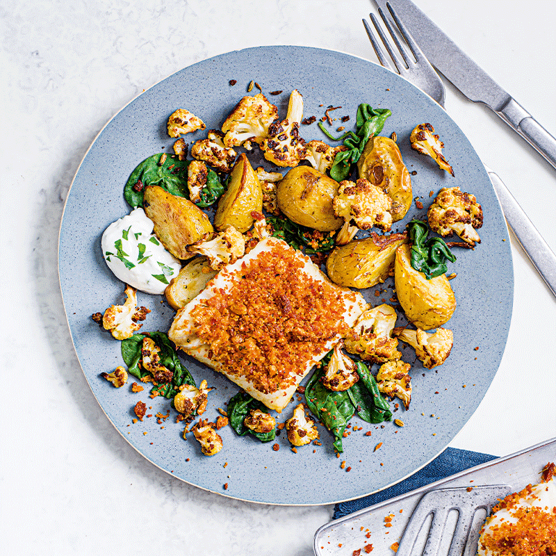 Chorizo-crusted fish with roasted cauliflower and potatoes