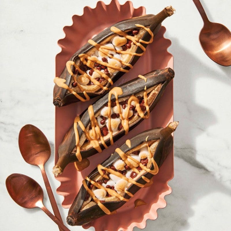 Photo of Grilled banana split boats with peanut butter sauce by WW
