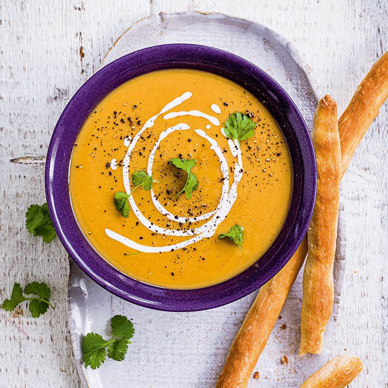 Spiced root vegetable and lentil soup with breadsticks