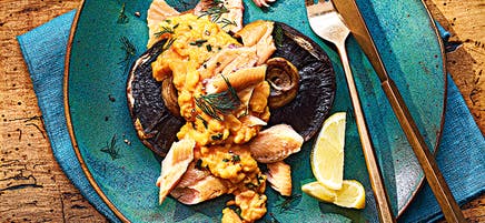 Scrambled eggs with mushrooms and hot smoked trout
