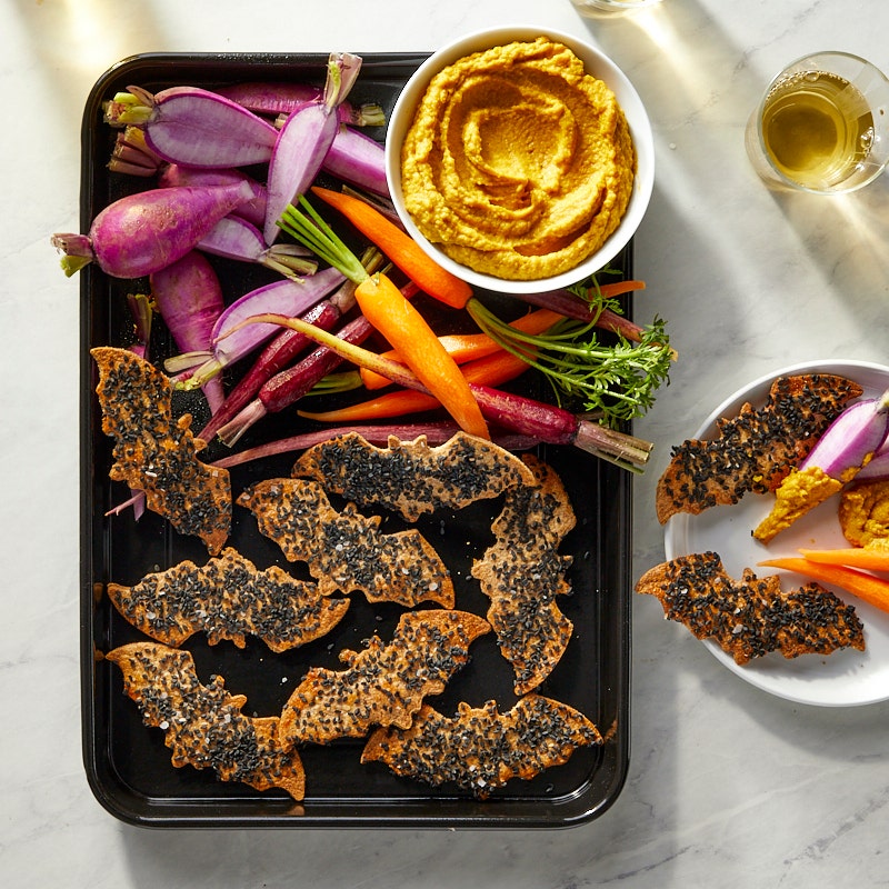 Spooky Sesame Tortilla Chips with Pumpkin Hummus and Veggies