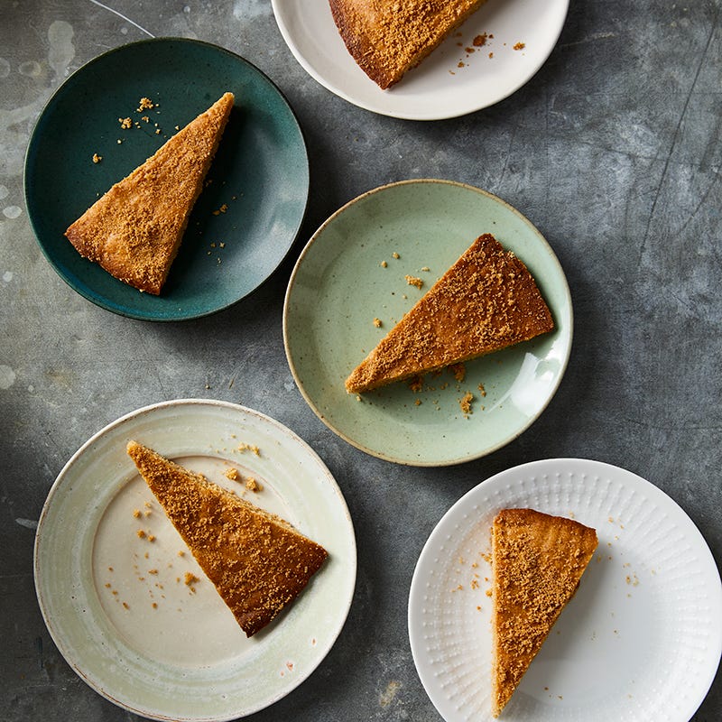 Small round plates with a slice of a churro skillet cookie on each