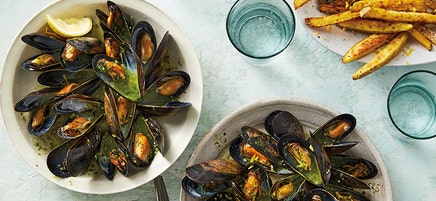 Mussels with pesto broth and lemony oven fries