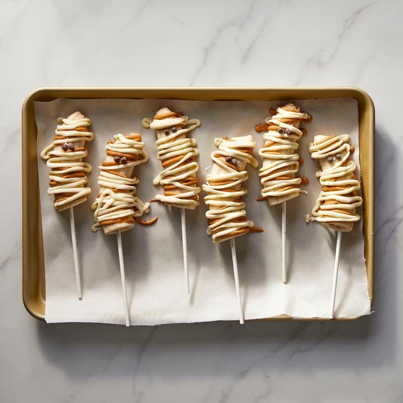 White chocolate and peanut butter banana mummy pops