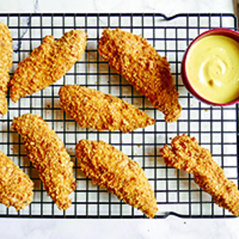 Foto van Met tortillachips gepaneerde kip met een honing-mosterdsaus door WW