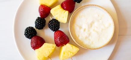 Fruit kebabs with piña colada dip