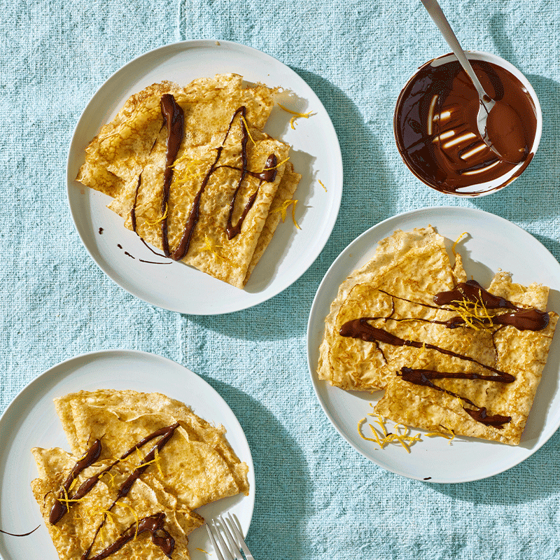 Orange crepes with chocolate drizzle