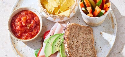 Turkey & avocado sandwich with chips and crudités