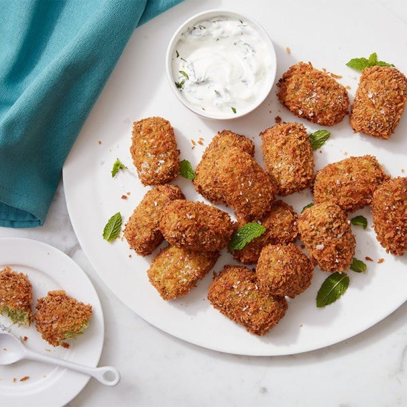 Photo of Cat Cora’s air-fryer zucchini tots with yogurt sauce by WW