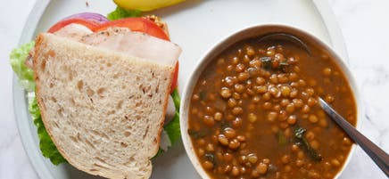 Lentil soup and half a turkey sandwich